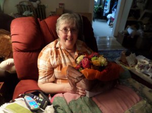 Mary enjoying her birthday flowers