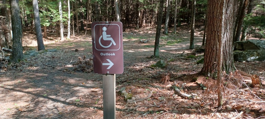 Handicapped access sign in a wooded area